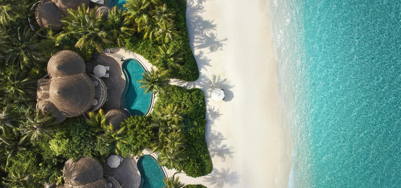 Beach Residences at The Nautilus Maldives from the air, on the sand above a turquoise lagoon.