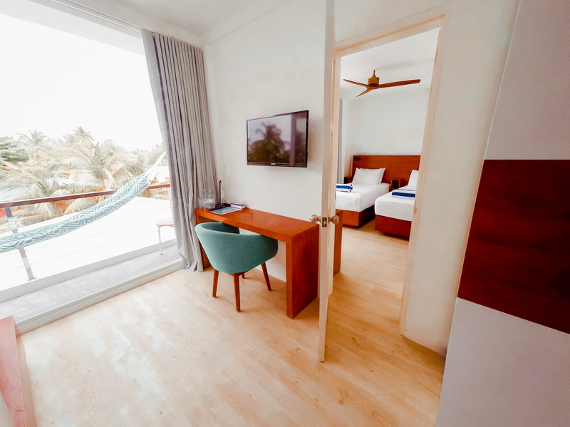 Family Room at Bliss Dhigurah, two connecting rooms with a balcony hammock
