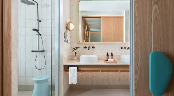 The bathroom of a One-Bedroom Sunset Overwater Pool Villa at Centara Grand Lagoon Maldives.