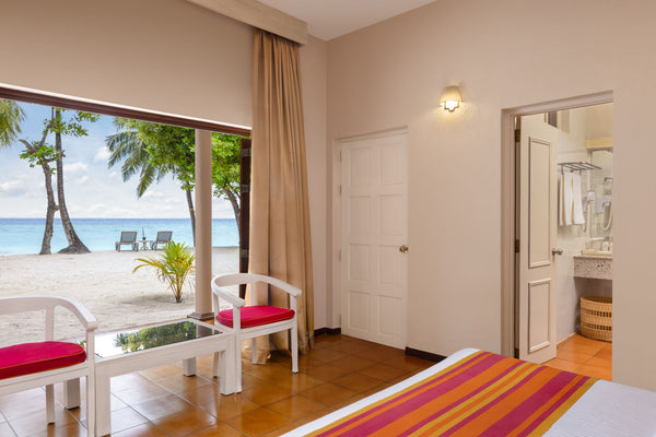 A Classic Beach View Room at Adaaran Club Rannalhi.