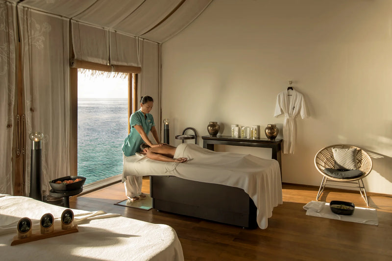 Constance Moofushi, South Ari Atoll: a massage in a spa treatment room with a window open onto the sea