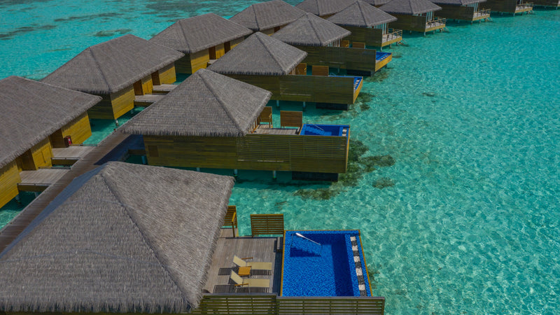 Overwater villas at Cocoon Maldives from the air.