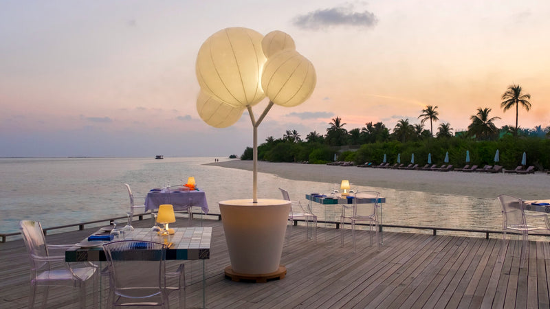 A deck lit with lanterns at Cocoon Maldives.