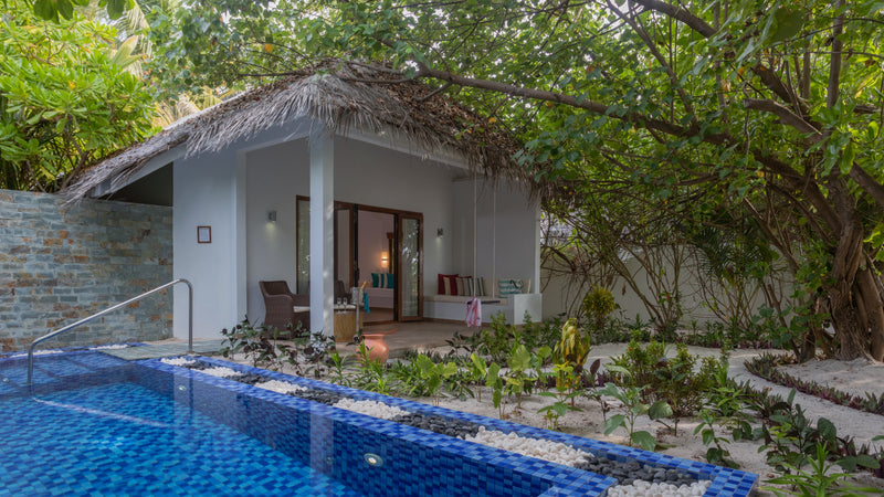 A beach villa with a pool at Cocoon Maldives.