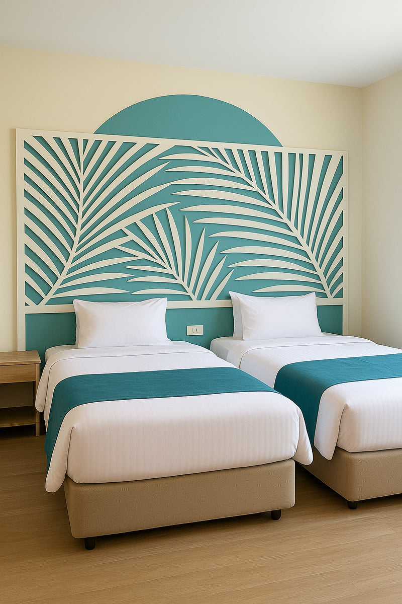 Room at KUE Hotel with two beds and a palm-leaf mural