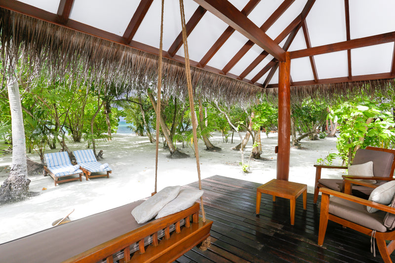The veranda of a Beach Villa at Medhufushi Island Resort.