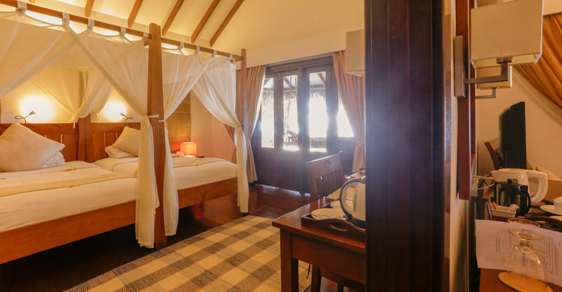 A Semi-detached Beach Villa at Medhufushi Island Resort.