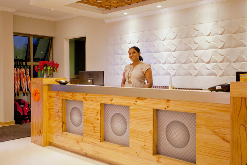 Reception desk in the Kaani Beach Hotel lobby