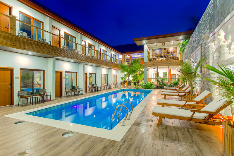 Pool at Kaani Village & Spa lit up in the evening