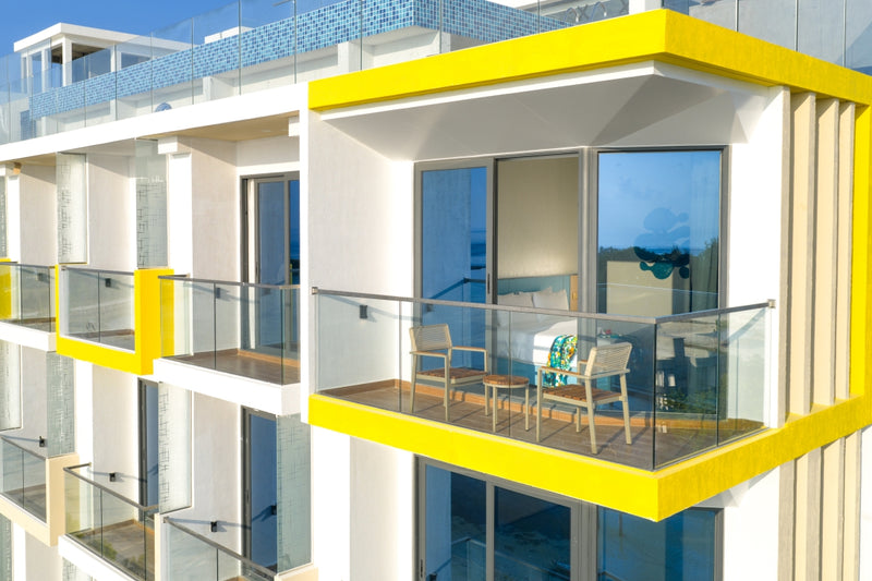 h78 Guraidhoo, South Malé Atoll: yellow-framed balconies on the side of the hotel