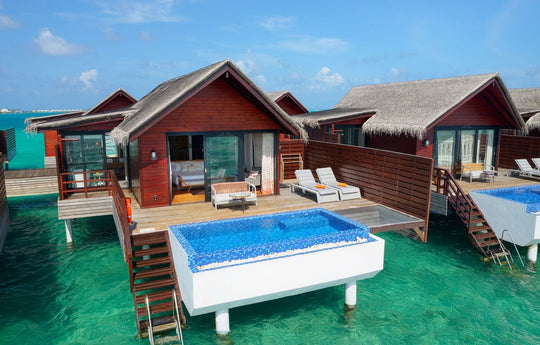 Pool Water Villas at Grand Park Kodhipparu, private pools and sun loungers on decks over turquoise water