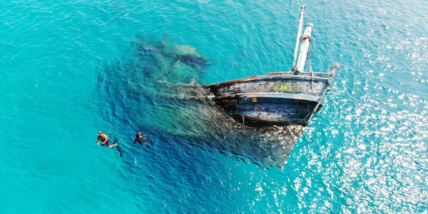 Snorkellers above a wreck at Holiday Inn Resort Kandooma Maldives.