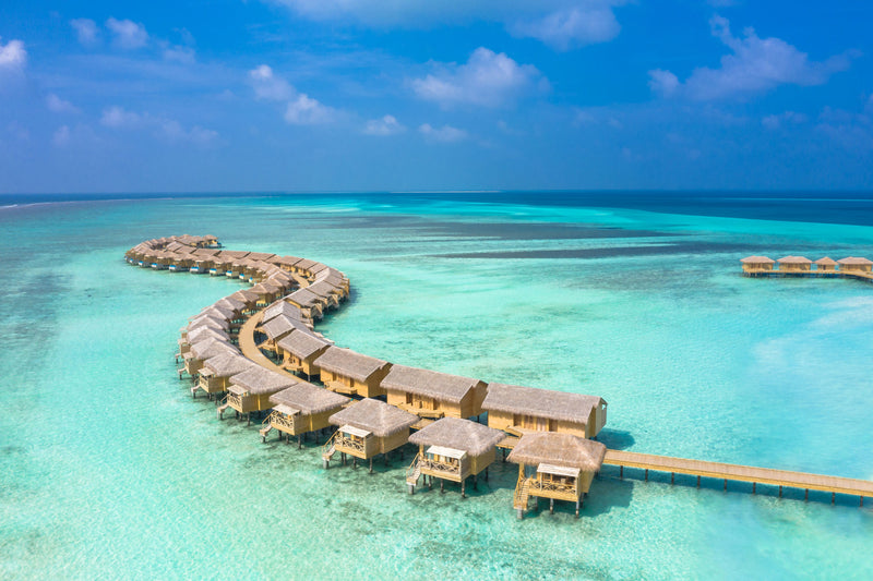 Another aerial view of the overwater villas at You & Me Maldives.