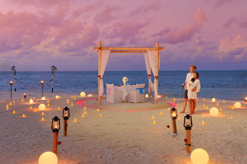 A canopy set on the beach at dusk at You & Me Maldives.