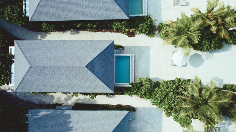 Jawakara Islands Maldives, Lhaviyani Atoll: Mabin beach pool villas from directly above, each with a private pool among the palms