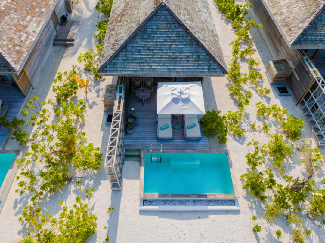 Kagi Maldives Resort &amp; Spa, North Malé Atoll — aerial view looking down on a beach villa&