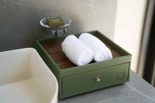 Rolled towels on a tray at the edge of a villa bath at ananea Madivaru Maldives