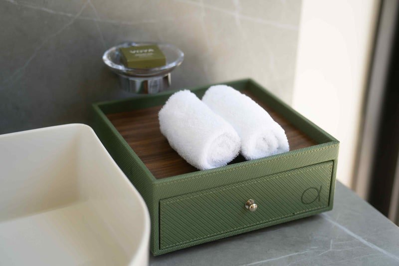 Rolled towels on a tray at the edge of a villa bath at ananea Madivaru Maldives