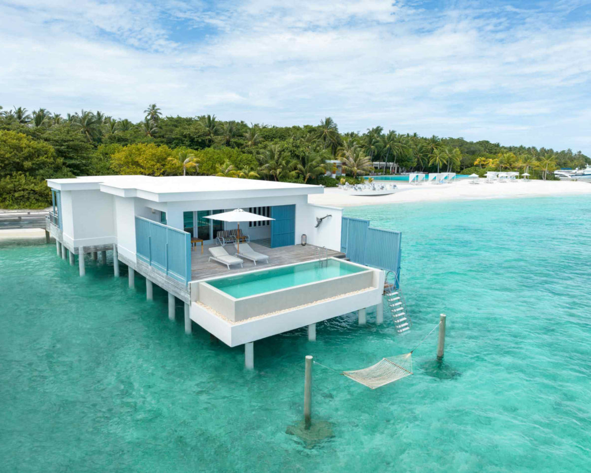 A Sunset Water Pool Villa at Amilla Maldives, its pool set into the deck above the turquoise lagoon