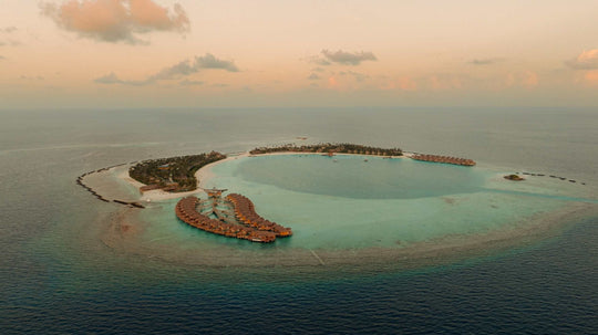 ananea Madivaru Maldives from the air at dusk, the two islands and the lagoon between them