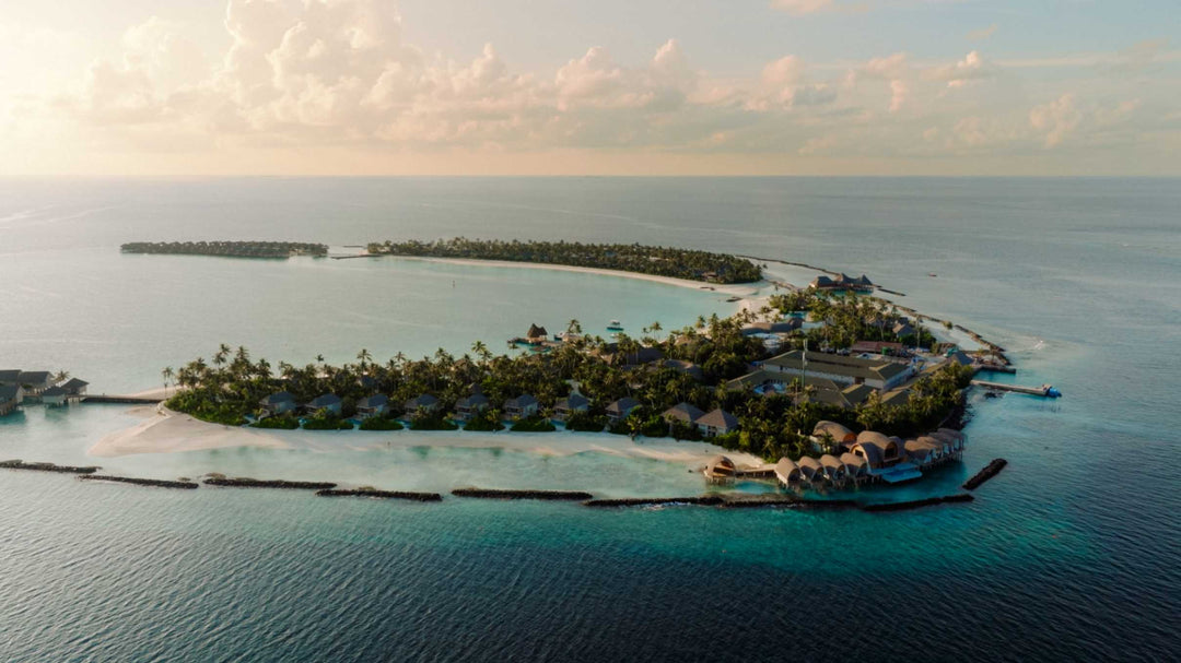 The full length of ananea Madivaru Maldives from the air, villas along both shores