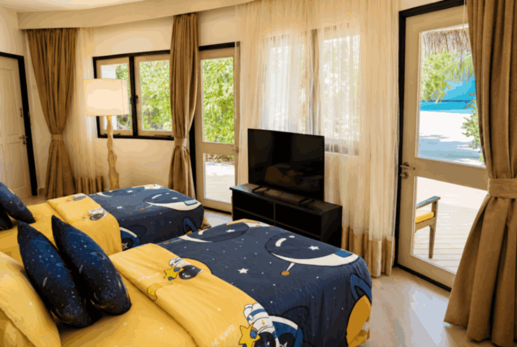 Angsana Velavaru, Dhaalu Atoll — twin beds made up with children&