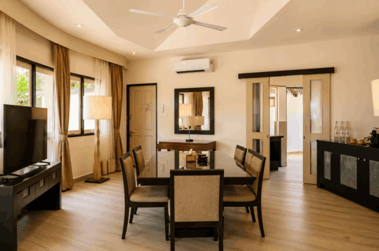 Angsana Velavaru, Dhaalu Atoll — the dining room of the three-bedroom pool villa, laid for six