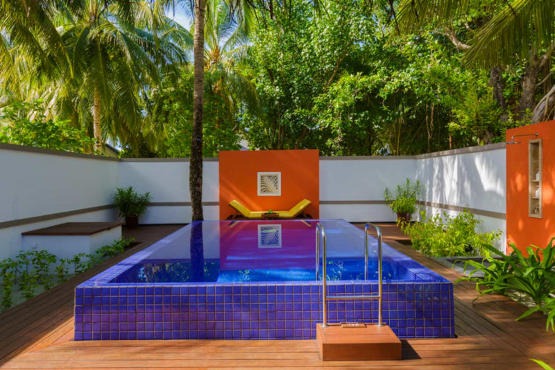 The private pool of a Deluxe Beachfront Pool Villa at Angsana Velavaru, with loungers on the deck.