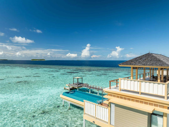 Angsana Velavaru, Dhaalu Atoll — the two-bedroom overwater villa and its pool, with the reef edge behind