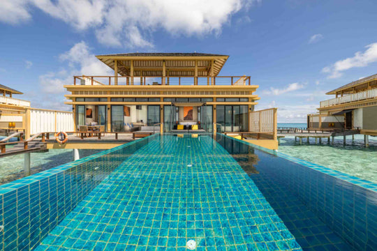 Angsana Velavaru, Dhaalu Atoll — the long infinity pool leading to the two-storey Deluxe InOcean Two-Bedroom Pool Villa