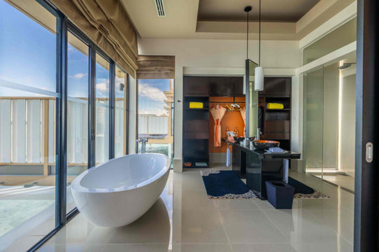Angsana Velavaru, Dhaalu Atoll — the bath and dressing area of an InOcean Pool Villa, open to the lagoon