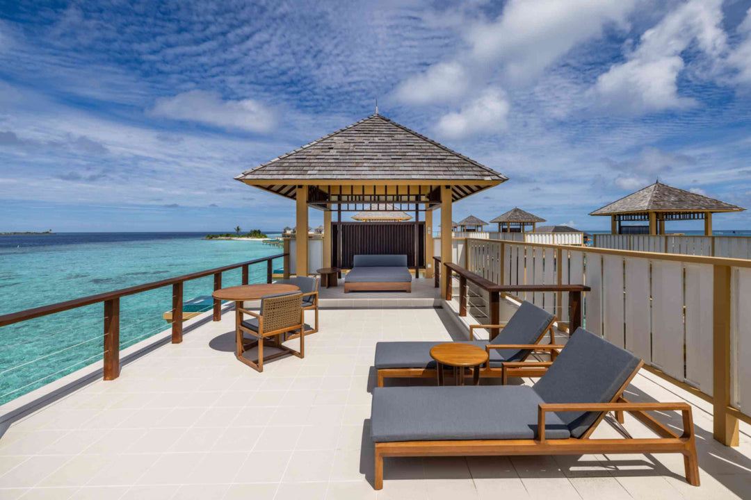 Angsana Velavaru, Dhaalu Atoll — the rooftop terrace of an InOcean Pool Villa, with loungers and a shaded pavilion