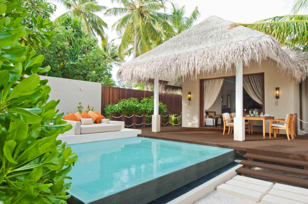 A beach villa at Ayada Maldives with its private pool, open living pavilion and garden