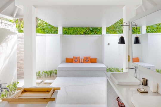 Sun Siyam Iru Veli, Dhaalu Atoll — open-air bathroom court with a daybed and planting along the walls
