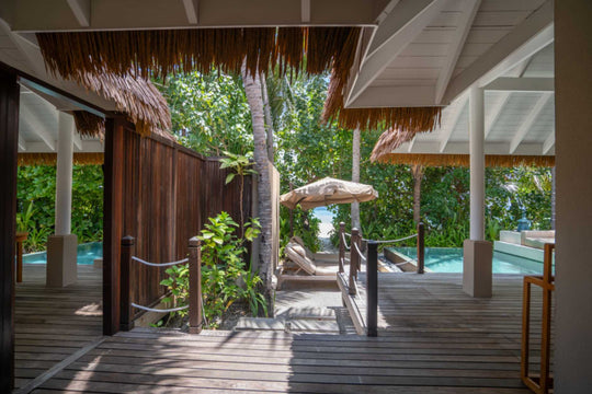 The deck connecting the two halves of a family beach villa at Ayada Maldives