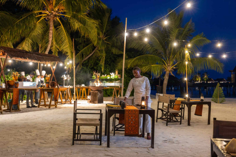 Braai night dinner set up on the beach at Niyama Private Islands