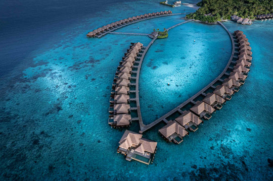 A closer aerial of the overwater villas at Ayada Maldives, walkways running between them