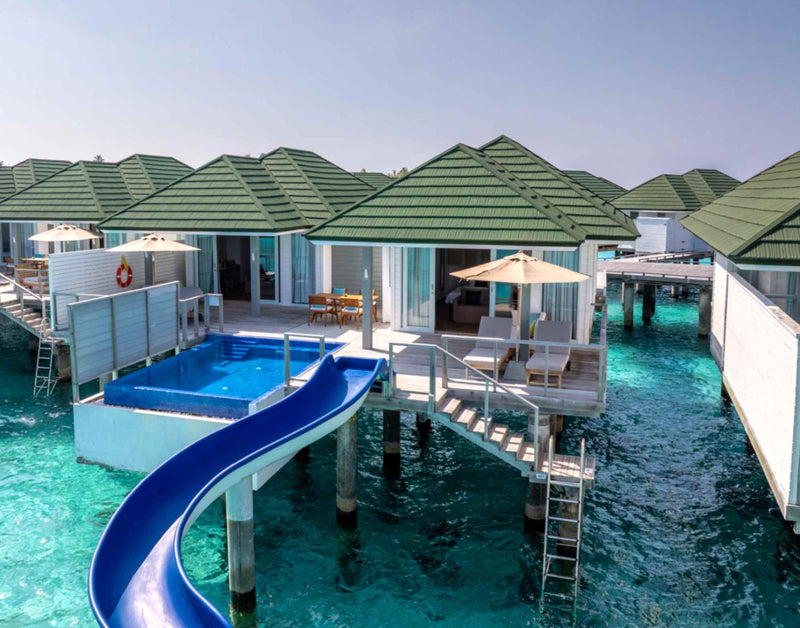 Aerial view of the overwater villas and lagoon at Siyam World, Noonu Atoll, Maldives