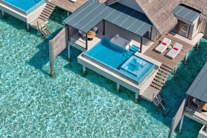 Deluxe Over Water Pool Villa at Niyama Private Islands seen from above, standing on stilts over the lagoon