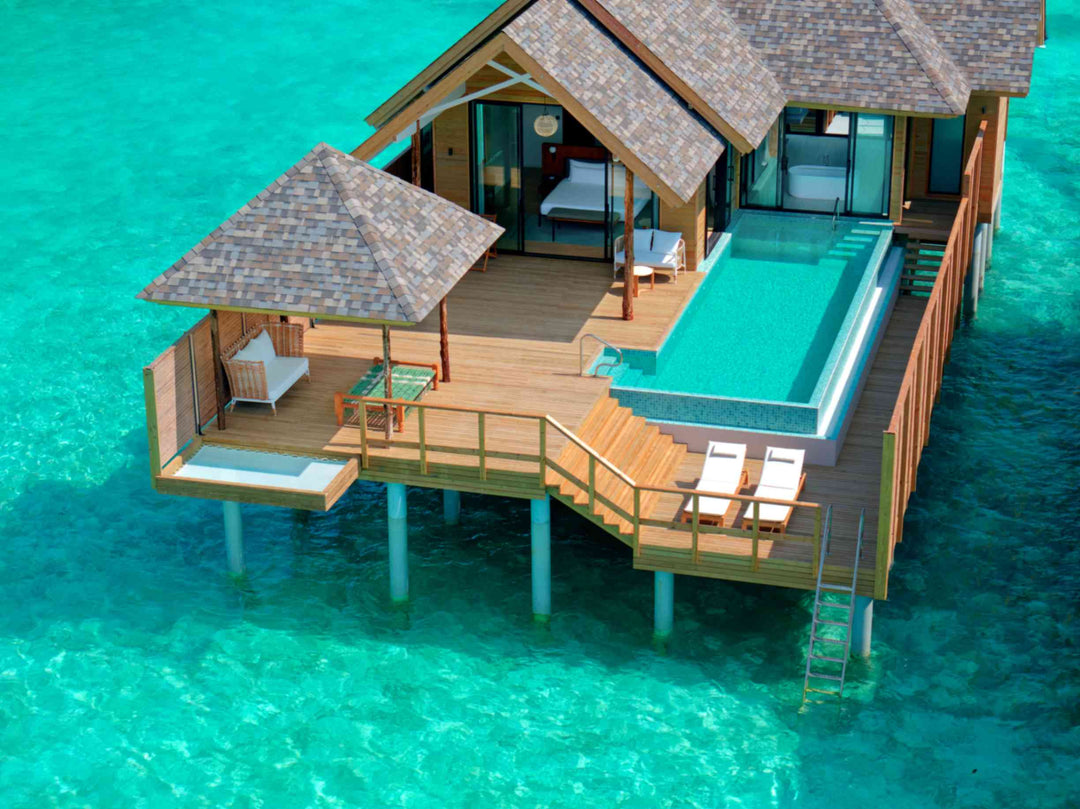 Deluxe Water Pool Villa, Lagoon View at ananea Madivaru Maldives, infinity pool and deck seen from above the lagoon