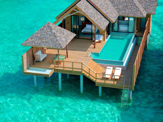 Deluxe Water Pool Villa, Lagoon View at ananea Madivaru Maldives, infinity pool and deck seen from above the lagoon