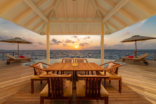 Sunset view from a Grand Water Pavilion with Pool and Slide at Siyam World, Noonu Atoll, Maldives