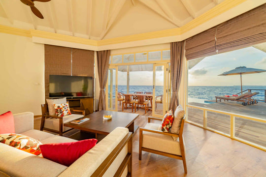 Living area of a Grand Water Pavilion with Pool and Slide at Siyam World, Noonu Atoll, Maldives