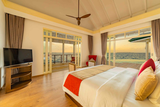 Bedroom of a Grand Water Pavilion with Pool and Slide at Siyam World, Noonu Atoll, Maldives