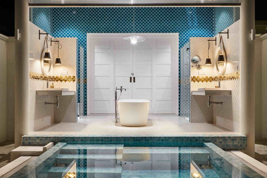 Sun Siyam Iru Veli, Dhaalu Atoll — open bathroom with twin basins and a tub, steps leading down into the pool