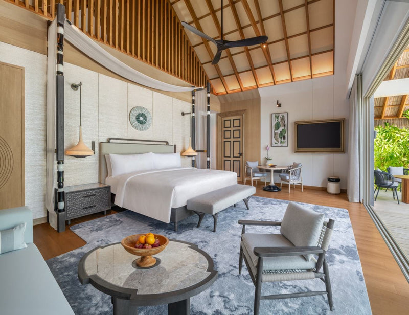 A Beach Pool Villa bedroom at JW Marriott Maldives looking out towards the deck