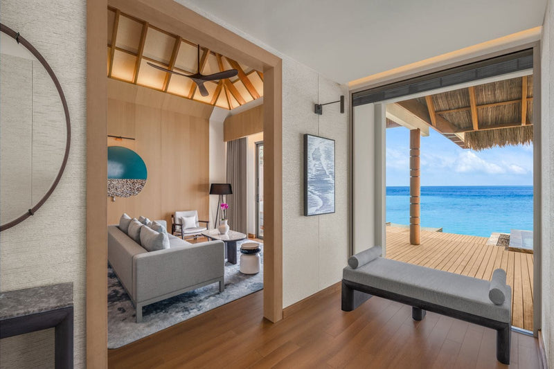 Living room of a One Bedroom Overwater Villa, JW Marriott Maldives Kaafu Atoll