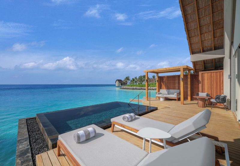 Pool deck of an Overwater Villa above the lagoon at JW Marriott Maldives