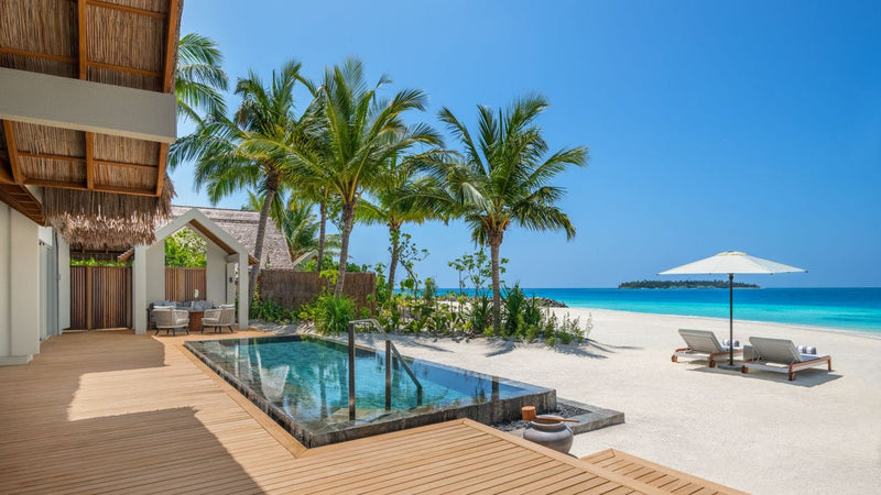 Pool deck of a Two Bedroom Beach Villa at JW Marriott Maldives