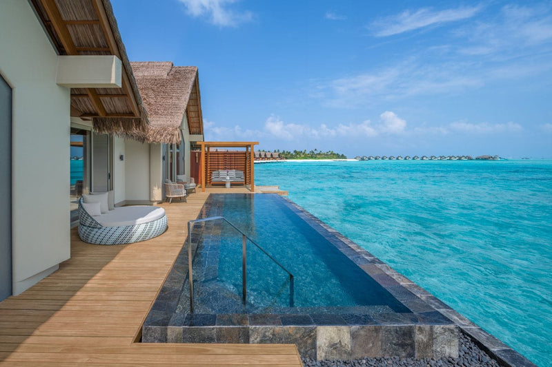 Pool deck of a Two Bedroom Overwater Villa above the lagoon at JW Marriott Maldives